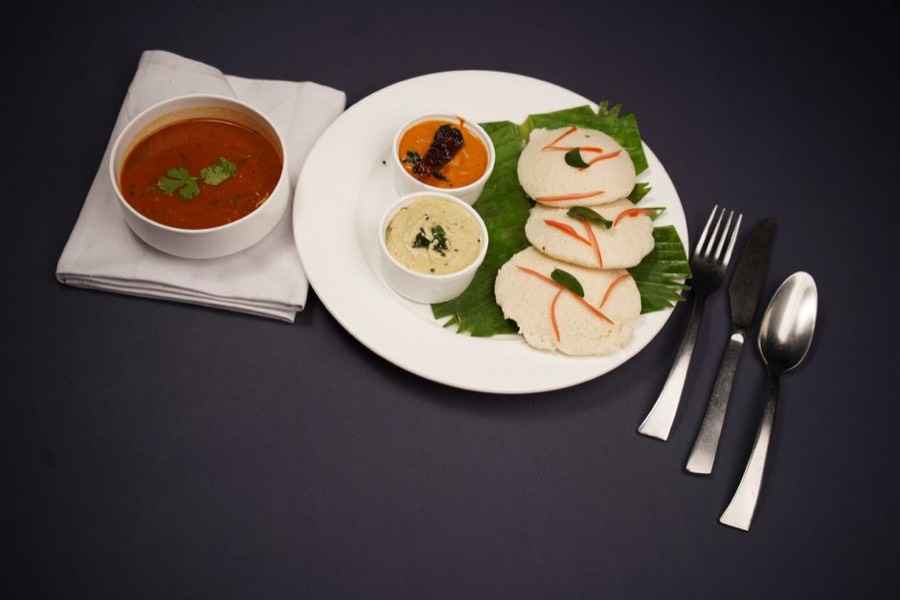 Steamed idli with sambar and coconut chutney